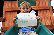 Boy holding a sign