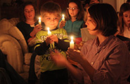 Family holding candles