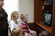 Family looking at a computer