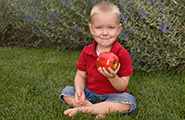 Boy eating an apple