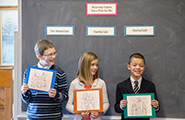 Children holding up signs