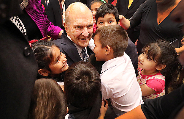 sident Russell M. Nelson of The Church of Jesus Christ of Latter-day Saints hugs children after a devotional in Asunción, Paraguay, on Monday, October 22, 2018. Photo by Jeffrey D. Allred, Deseret News.