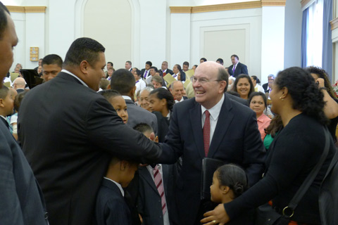 Elder Cook with members in New Zealand