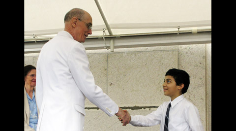 Elder Eyring shaking hands