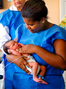 woman holding an infant