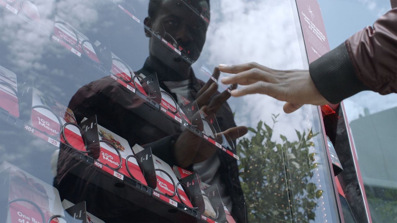 A man looks into a giving machine