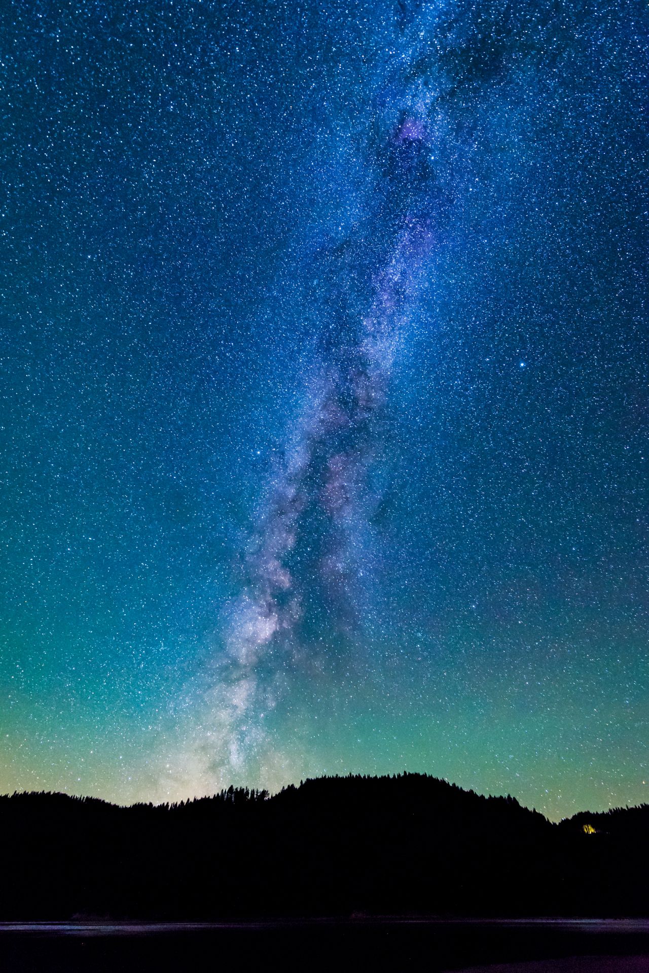 The milky way is shown shining in the night sky