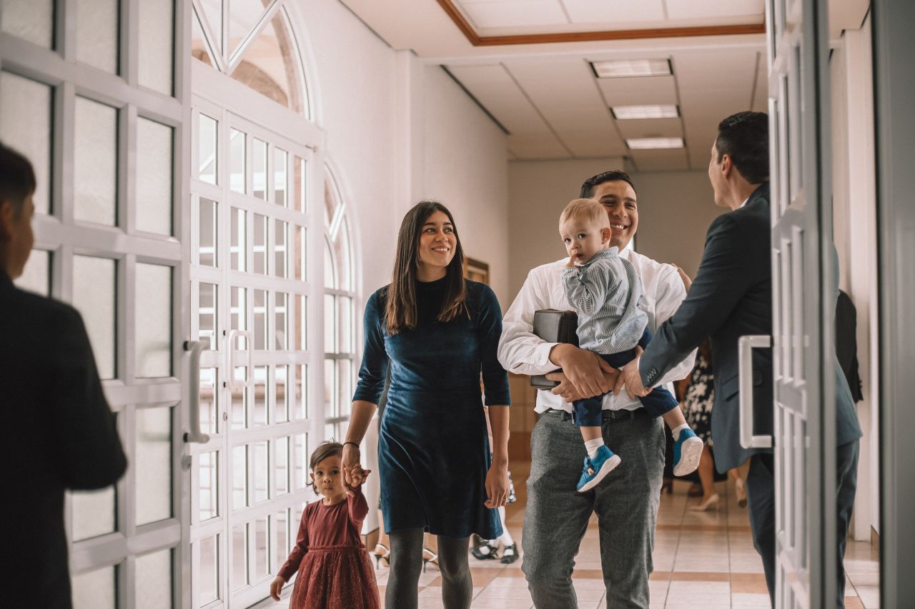 A young family enters a church to learn about the gospel of Jesus Christ