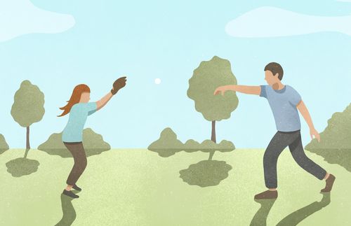 father and daughter playing catch