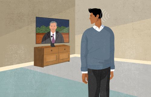 man looking over shoulder at conference on television