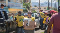 group of people in yellow vests