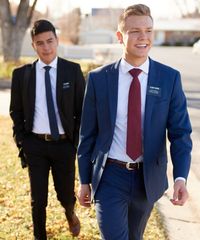 Missionaries model appropriate dress and attire. They are wearing approved suits, ties, and shoes.