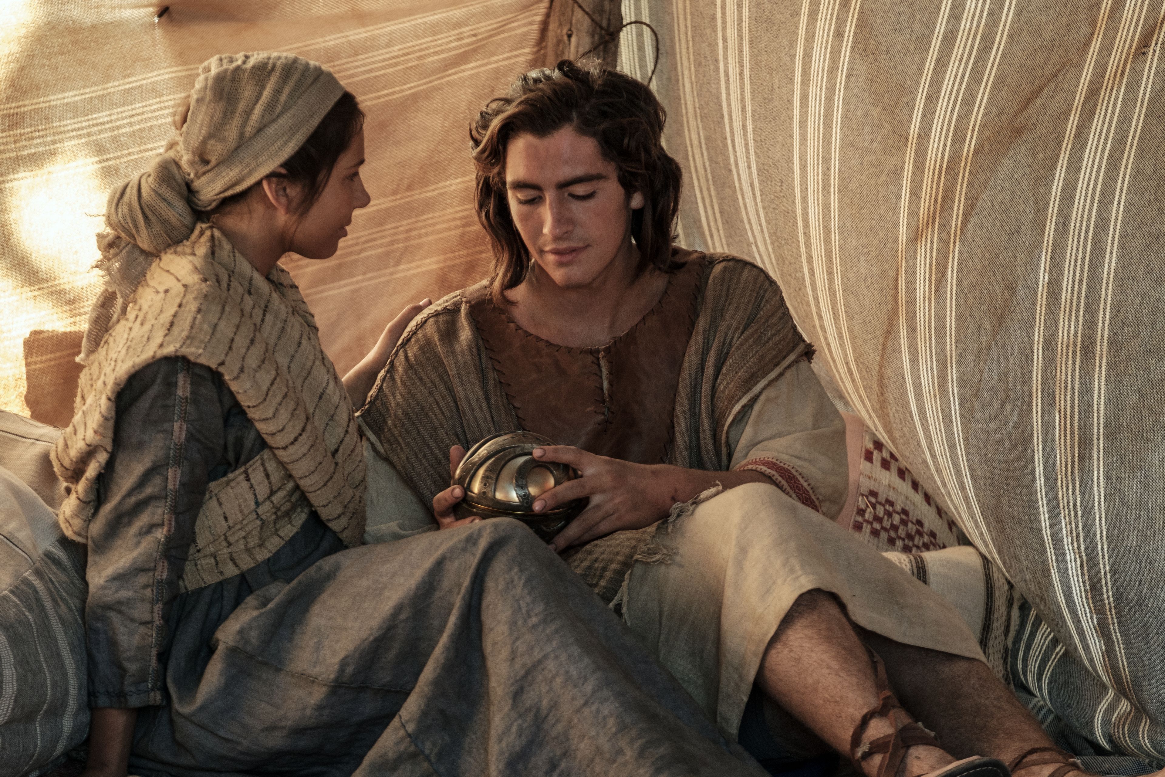 Nephi and his wife look at the Liahona.