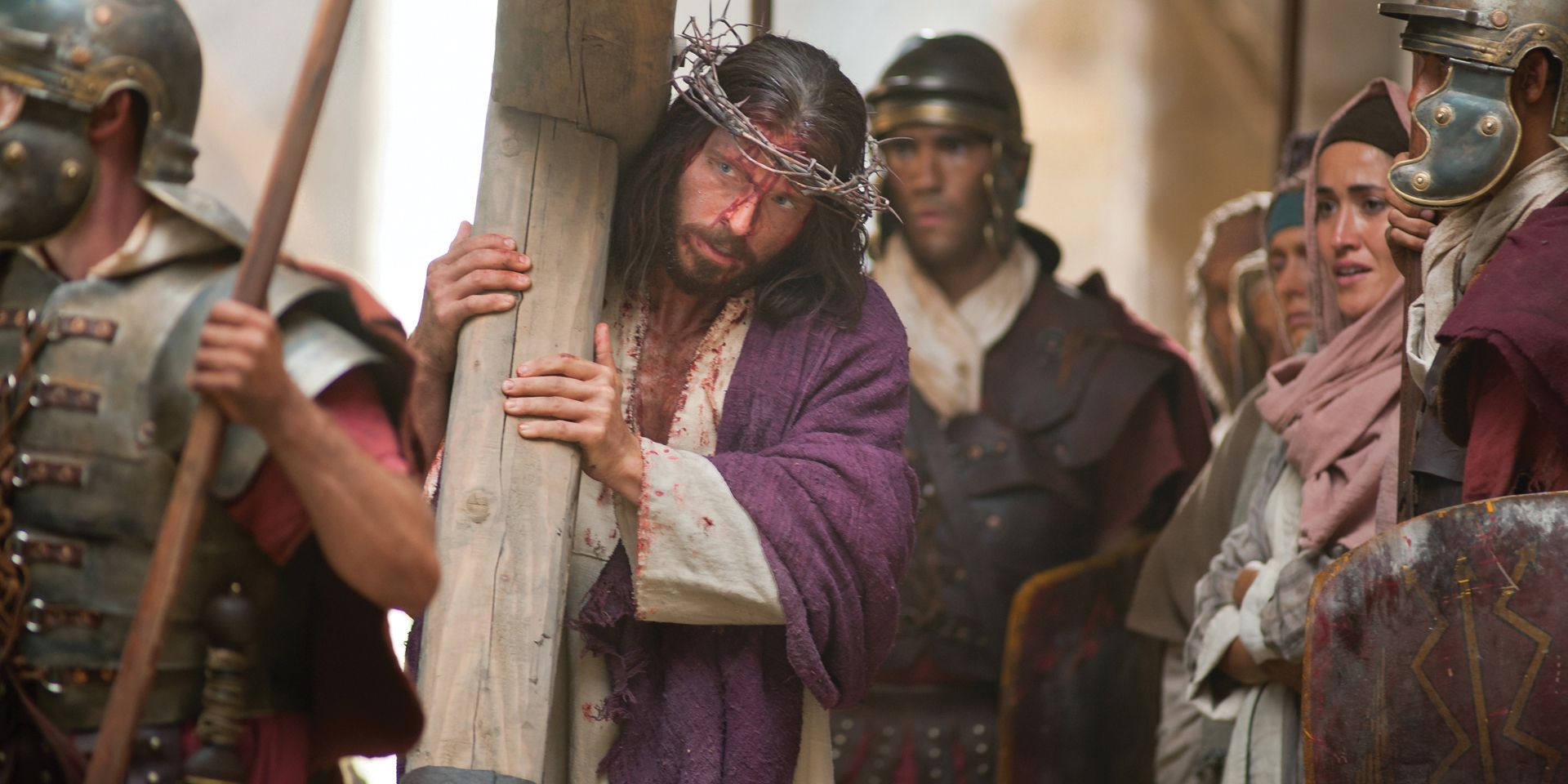 Jesus carries His cross on the way to His Crucifixion. 