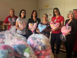 group of people delivering pillows to hospital
