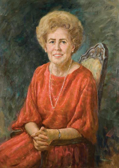 A painted portrait of Naomi Maxfield Shumway sitting in an upholstered chair against a blue background, wearing a red dress and pearls.