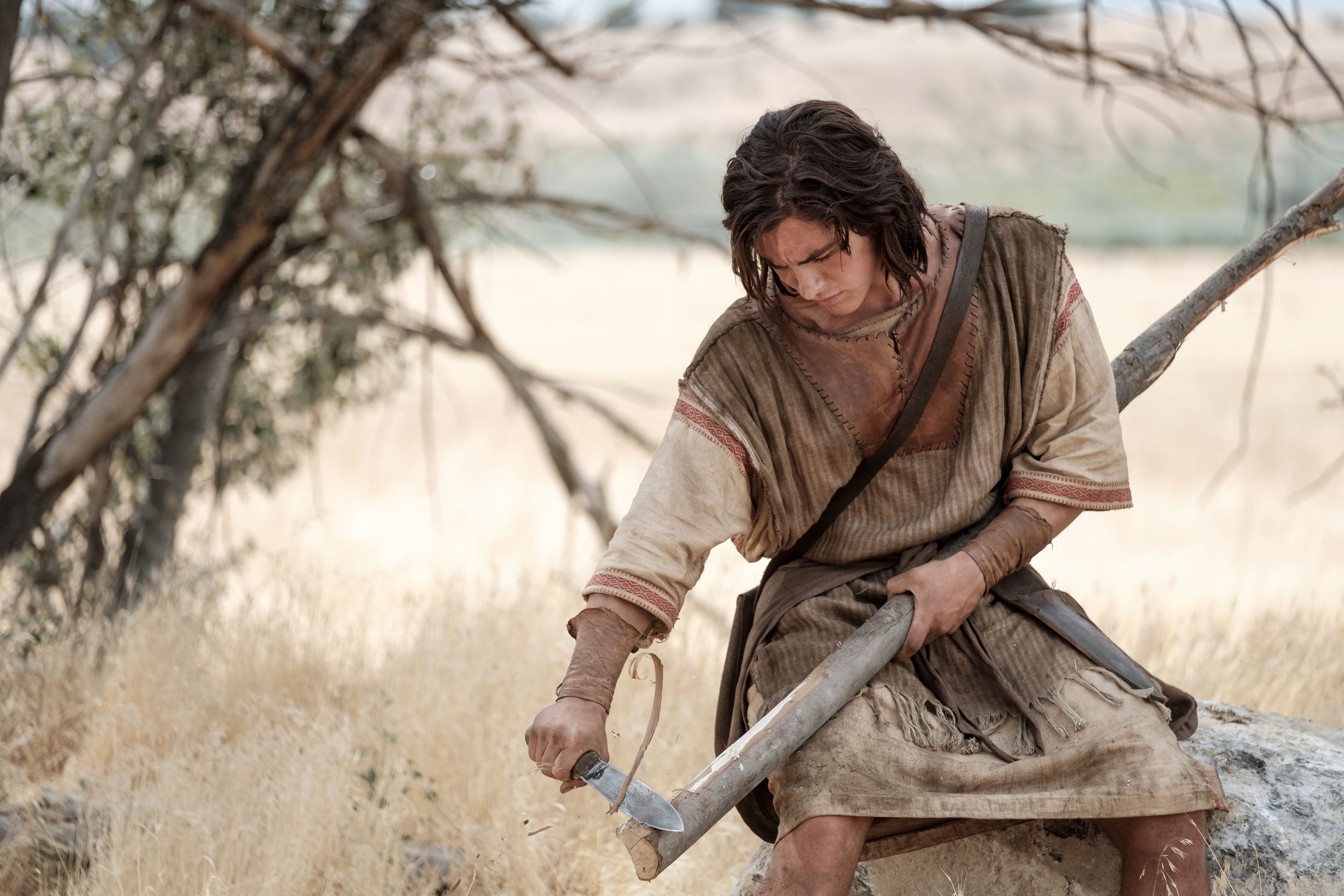 Nephi crafts a bow in the wilderness.