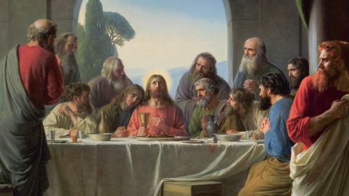 Cristo y los discípulos en la Última Cena mientras Judas se va