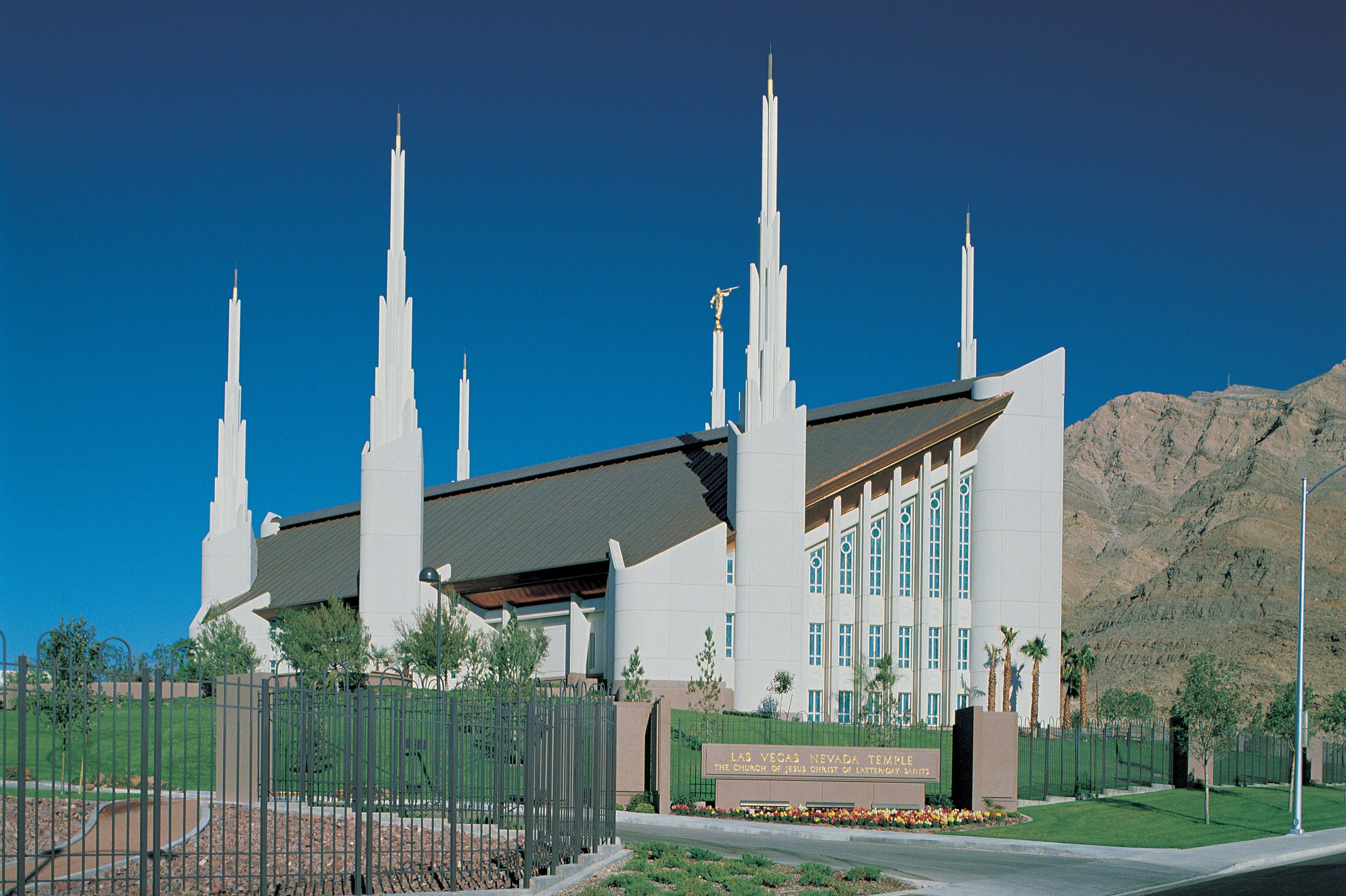 The Las Vegas Nevada Temple and the surrounding mountains on a clear day.