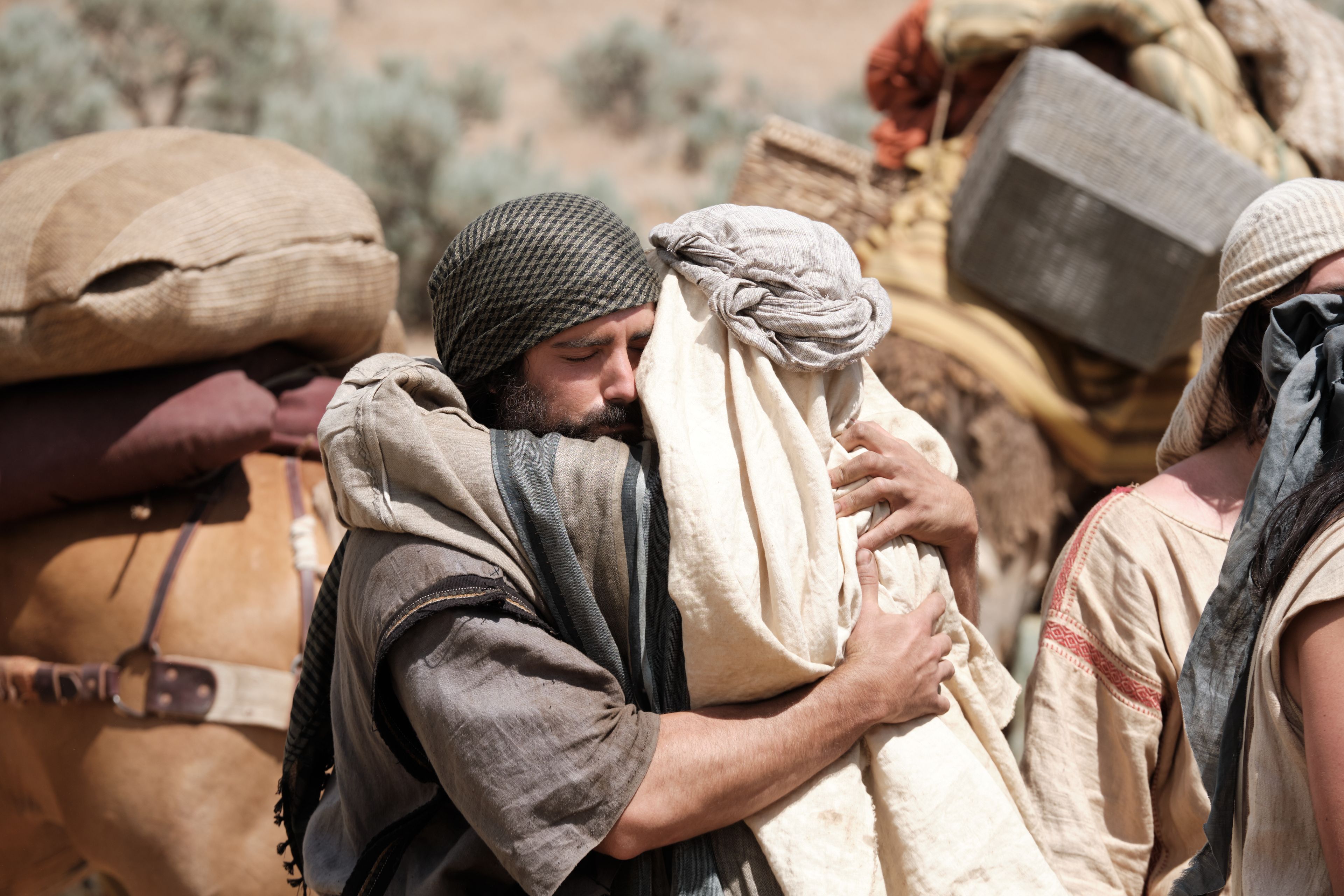 Lehi hugs Lemuel upon the brothers' return from Jerusalem.