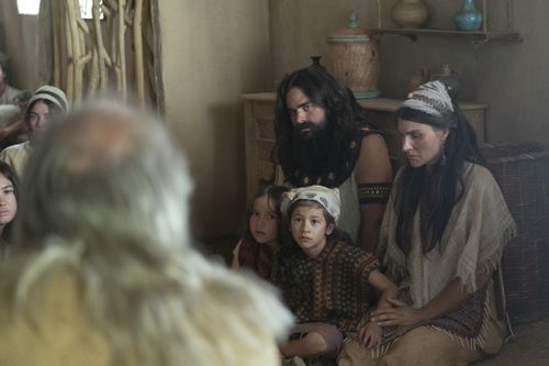 Laman and his family listen to Lehi teach.