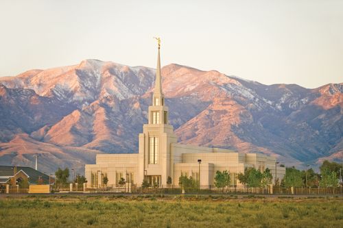 A view of The Gila Valley Arizona Temple, with a view of the surrounding grounds and the mountains in the background.