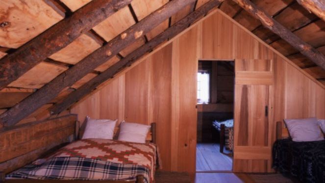 Interior shot of the Smith log home (cabin) on the Smith family farm.  This is a shot of the loft in the home.  Beds can be seen in the two different rooms.
