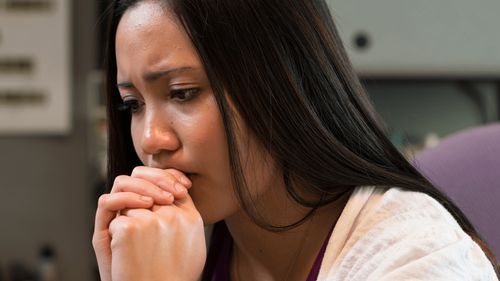 a woman in sincere prayer
