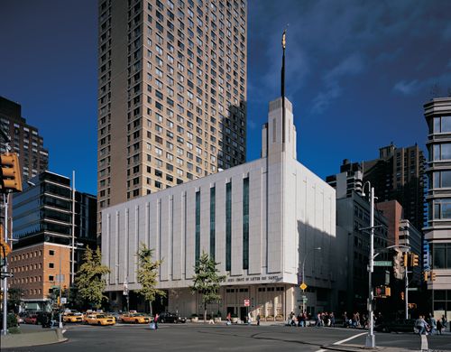 A view of the front entrance and side of the Manhattan New York Temple from across the street.