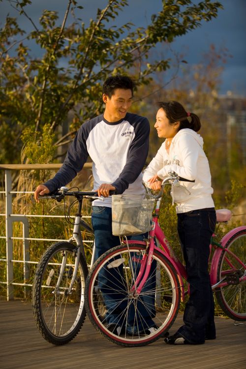 man and woman biking