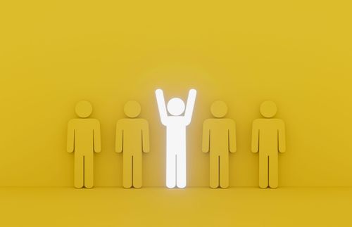 an illustration of a lit-up figure in the middle of dull figures