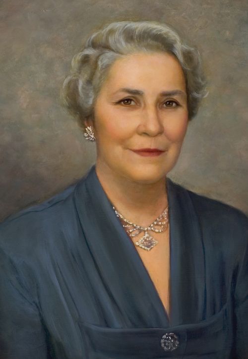A painted portrait by Dean Fausett of Bertha Stone Reeder against a light brown and gray background, wearing a steel-blue dress and a necklace.