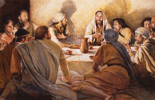 Jesus Christ and eleven apostles seated on the floor around a low table