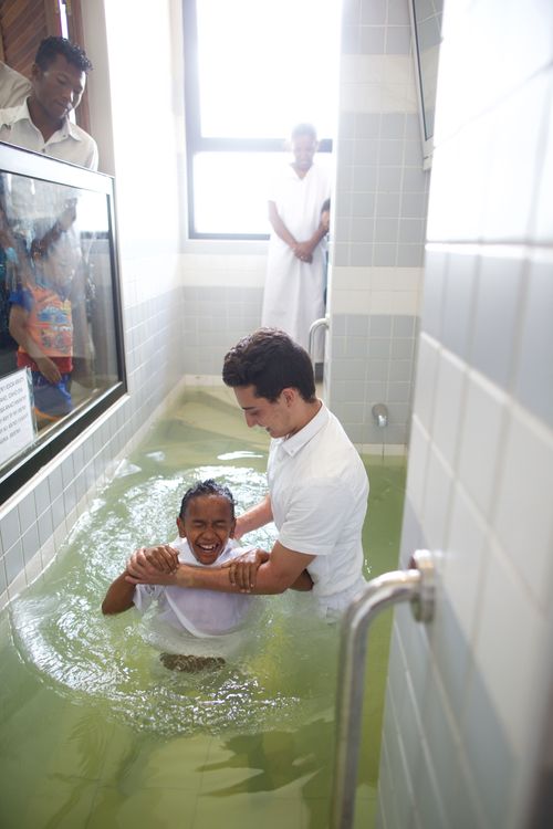 A young boy being baptized in a Church building in Madagascar.