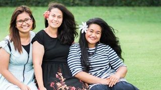 three young women outside