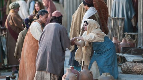 money changers on the steps of the temple