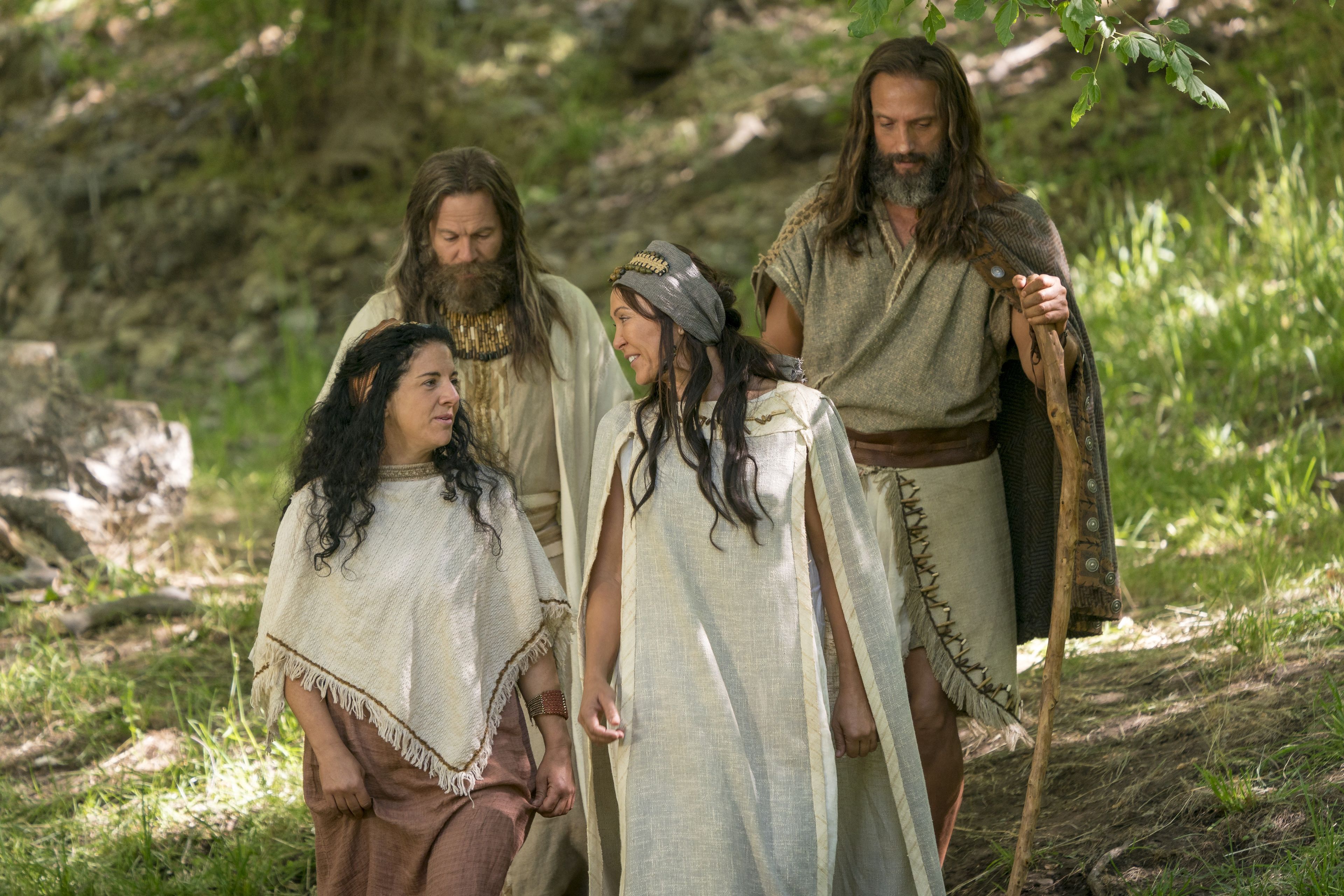 Nephi, Jacob, and their wives walking together outside.