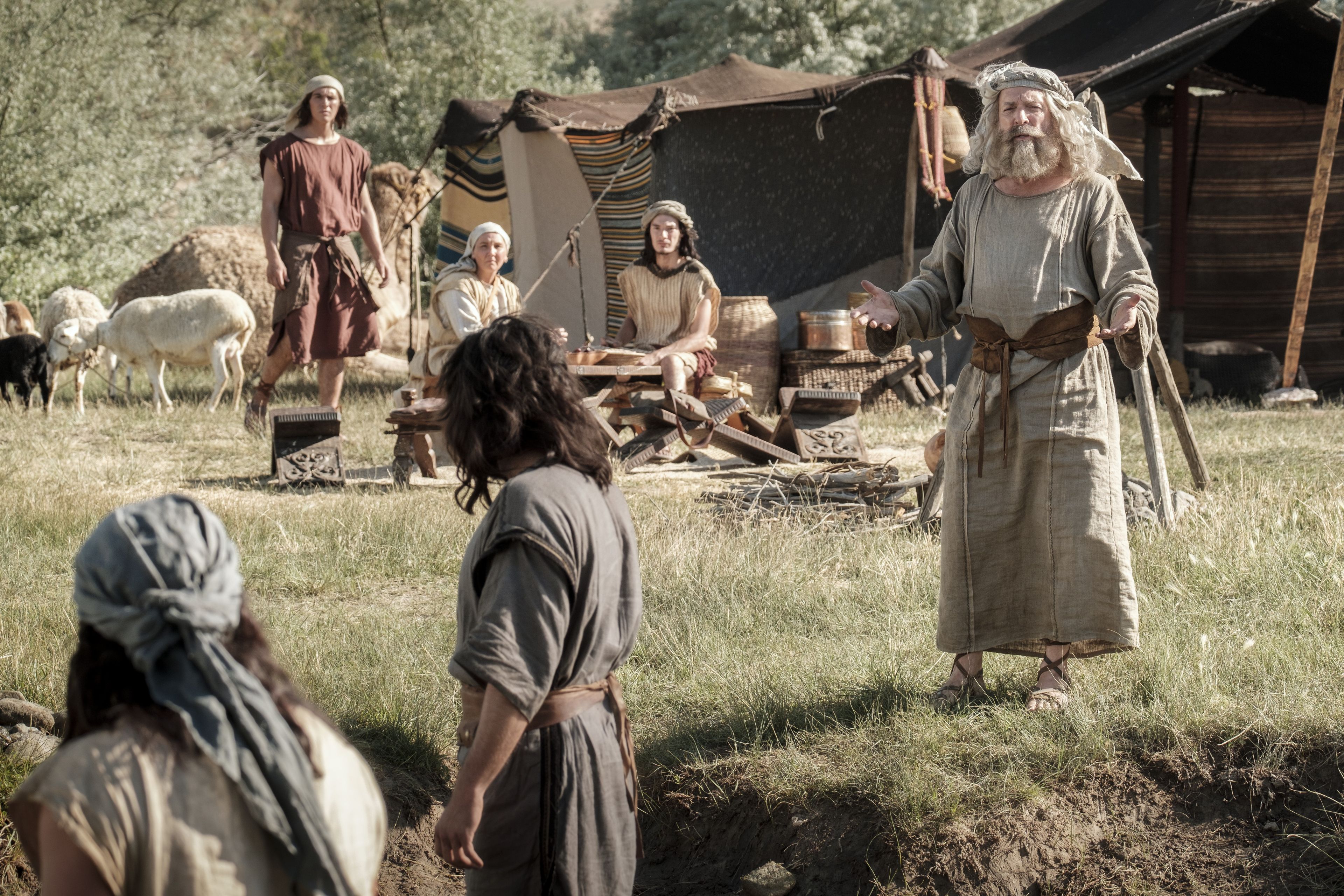 Lehi preaches to his family in their camp in the wilderness.