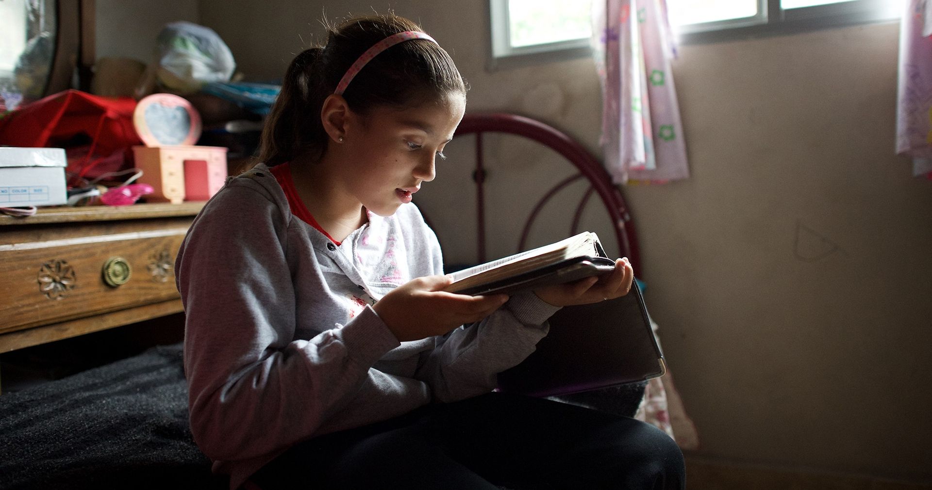 A young Uruguayan girl studies the scriptures.