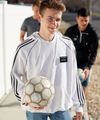 A missionary models appropriate dress and attire. He is wearing approved clothing for physical activity.