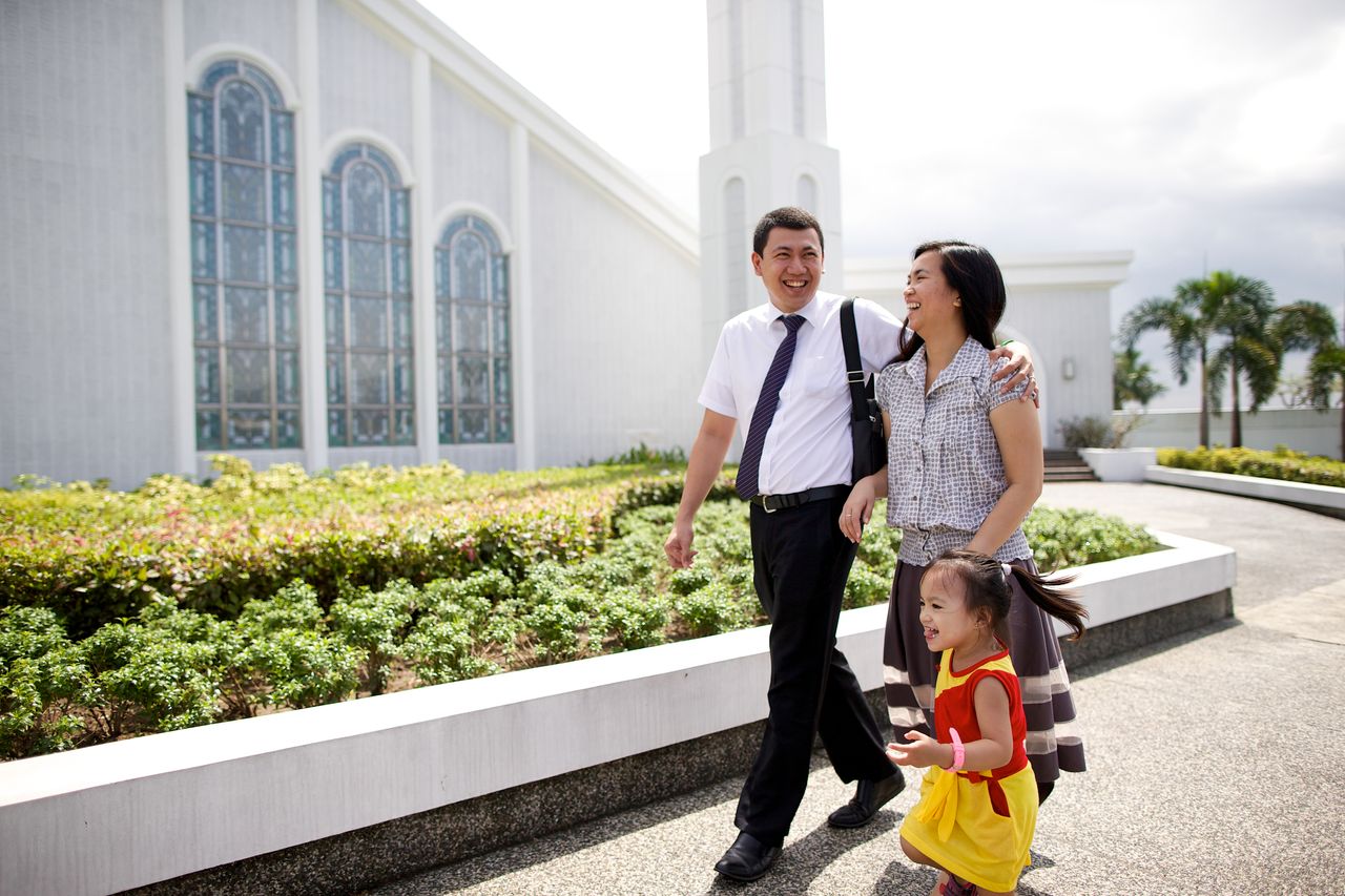 A young family walk to church