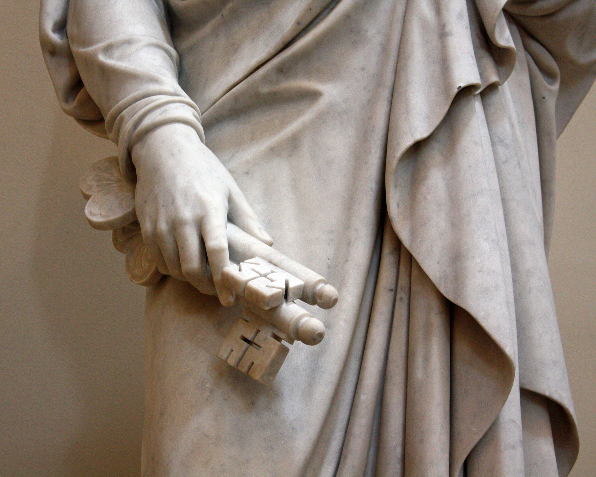 A photo of a statue of the Apostle Peter holding the keys of the gospel.