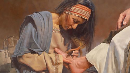 a woman washes the Savior’s feet with her tears
