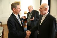 David A. Bednar meets with the archbishop of Buenos Aires in February 2016.