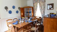 Interior of Kimball Home--table set with china
