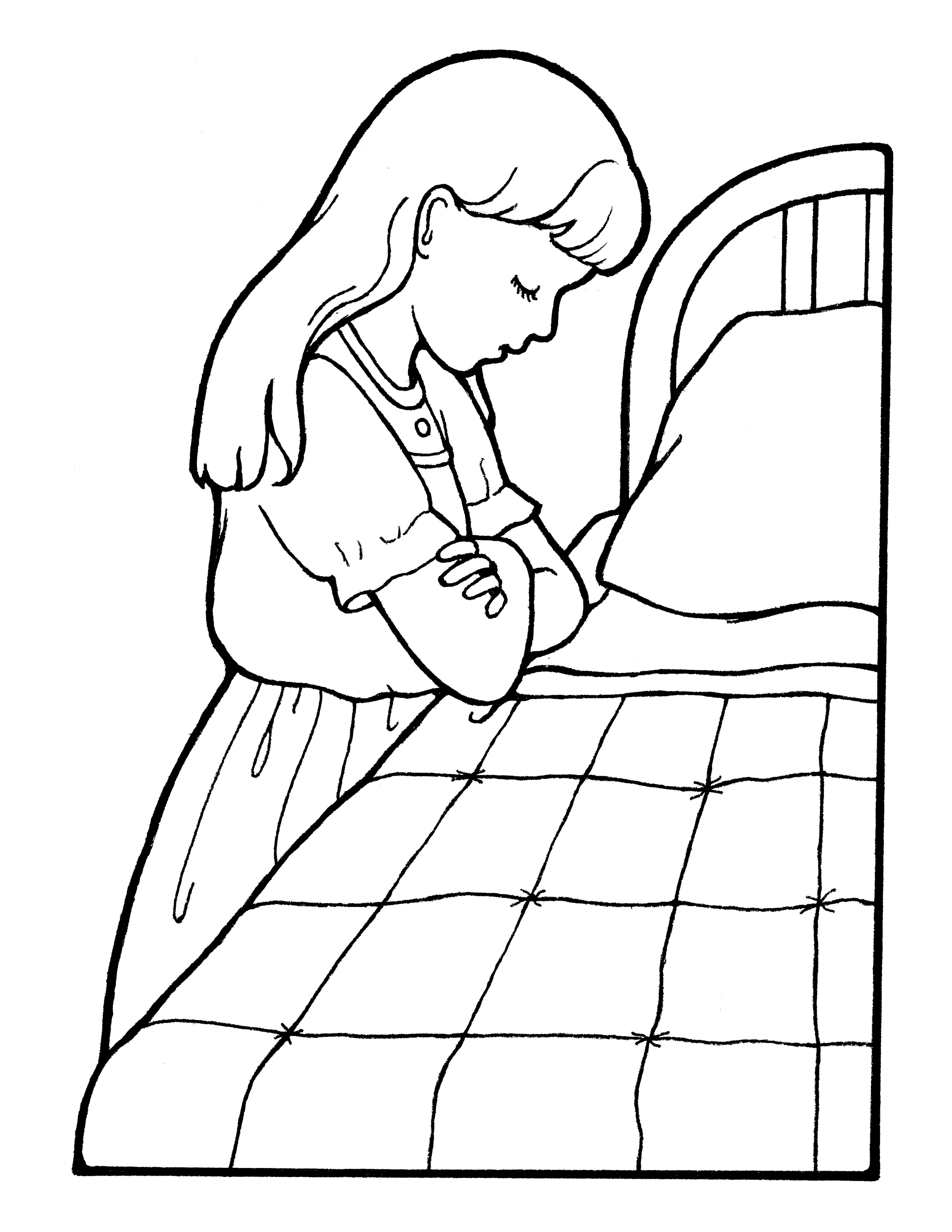 A picture of a girl praying by her bedside before bed.