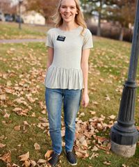 A sister missionary models appropriate dress and attire. She is wearing approved clothing for casual use.