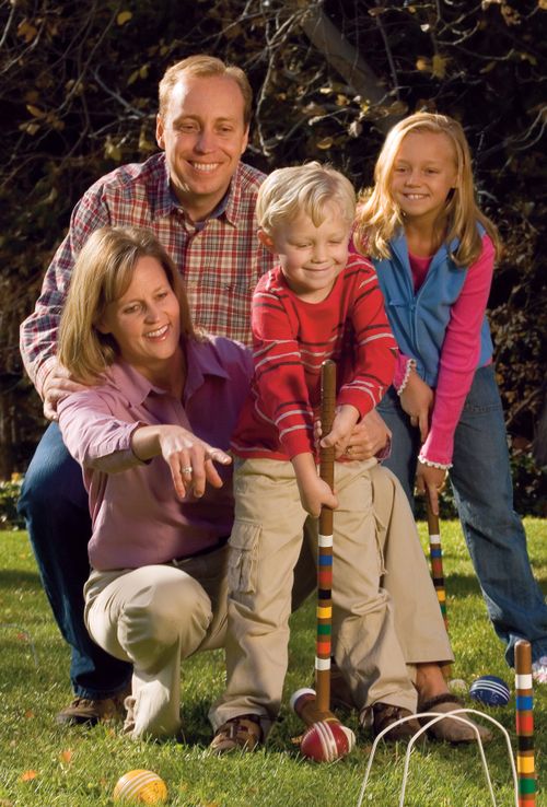family playing croquet