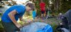 young man setting up tent