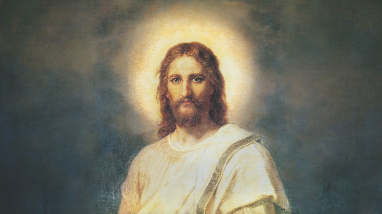 Classical painting of the face of Jesus Christ with a halo of light around his head.